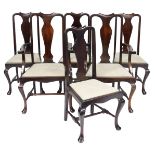 A set of six early 20thC Georgian style mahogany dining chairs, with drop in seats, raised on cabrio