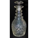 A Regency cut glass three ringed decanter, with a mushroom shape stopper, 26cm high.