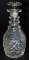 A Regency cut glass three ringed decanter, with a mushroom shape stopper, 26cm high.