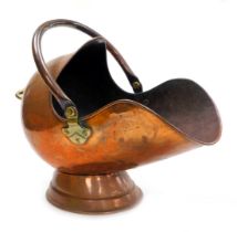 A Victorian copper helmet shaped coal scuttle, 50cm wide.