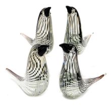 Four Murano style glass figures of sea birds, modelled with black beaks and eyes, 22cm wide.