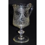 A late 19thC tankard, engraved with swags of flowers, and etched "Present to Lily Crocher on her bir