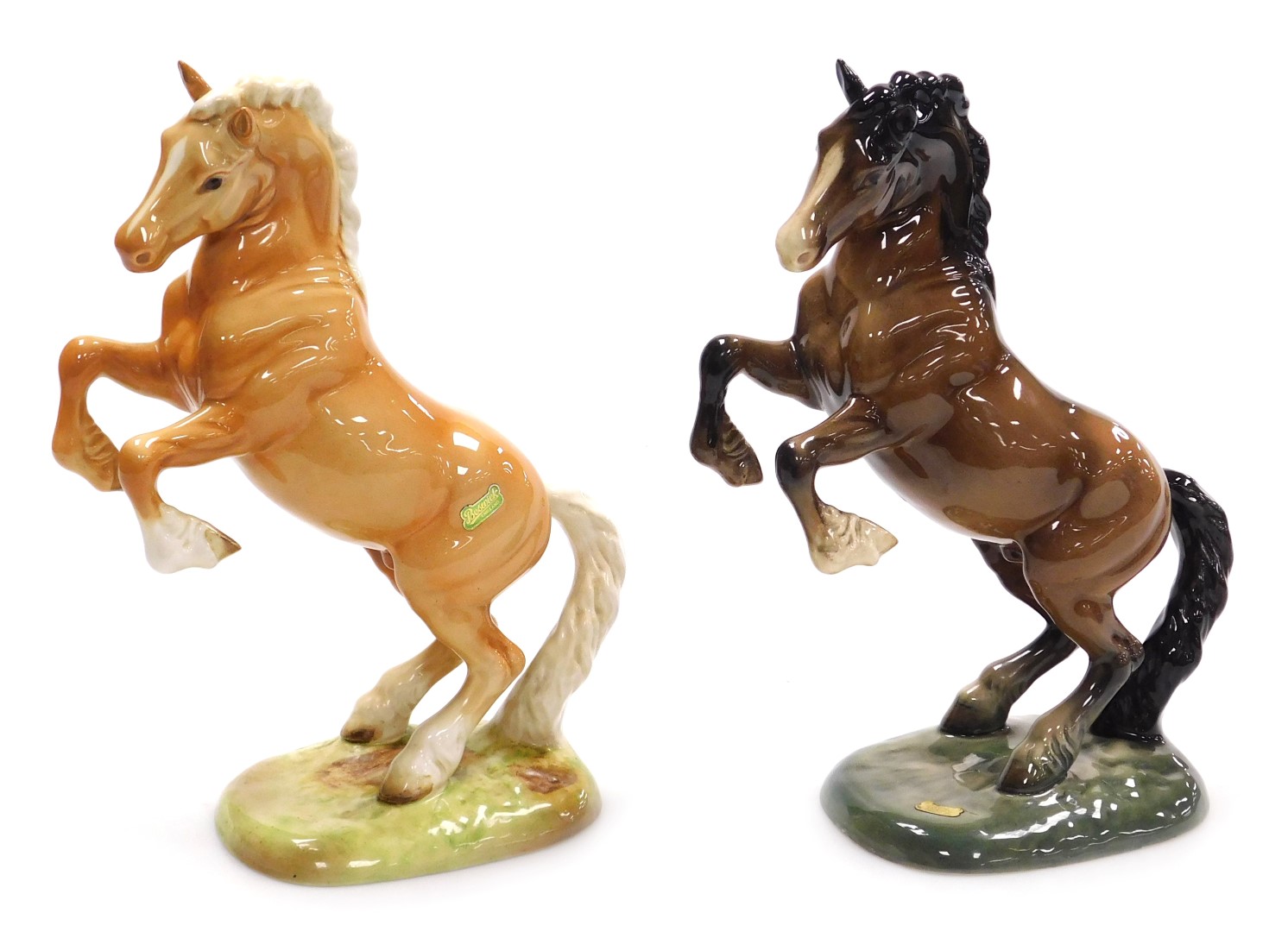 Two Beswick pottery figures of rearing horses, model number 1015, one Palomino, the other brown glos