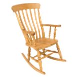 A lath back beech and elm rocking chair, 66cm wide.