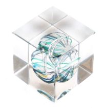 An Orrefors glass cube paperweight, with an abstract sea urchin type inclusion, etched mark, 4cm wid