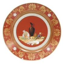 A mid 19thC Sevres Etruscan red ground hard paste porcelain dessert plate, decorated with a still li