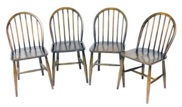 A set of four Ercol dark elm Windsor dining chairs.