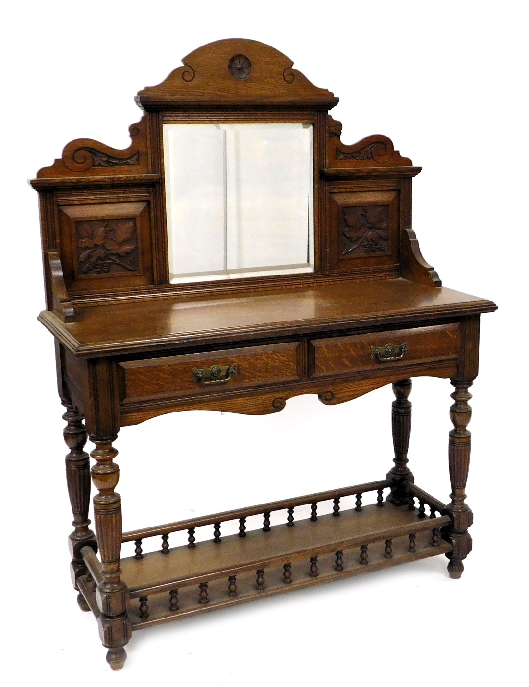 A Victorian oak mirror back washstand, by Miller and Sons, the back inset with square bevelled glass
