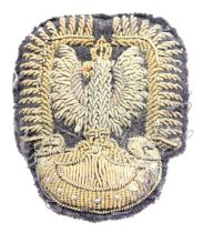 A WWII Polish officer's Air Force Eagle cap badge.
