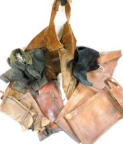 A brown leather apron, together with a pair of brown leather chaps, leg protectors, a waxed jacket,