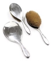A pair of early 20thC silver backed hairbrushes, with engraved floral and foliate decoration, hallma