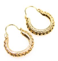 A pair of pierced hoop earrings, stamped 14k, 3.1g.