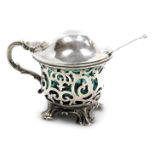 A Victorian silver mustard pot, with turquoise blue liner and pierced foliate decoration, raised on