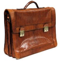 A tan leather briefcase, with leather shoulder strap, 44cm wide.