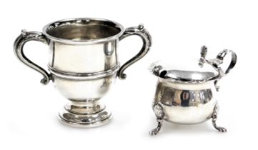 A George V silver twin handled trophy, Birmingham 1935, together with a Victorian silver mustard pot