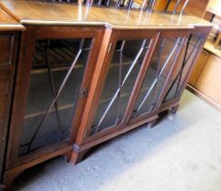 A reproduction mahogany bookcase, with glazed doors, two to centre flanked by two shelves to interio