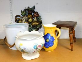 Two planters, one in the form of a pail, one with floral decoration, a small wooden footstool, a jug