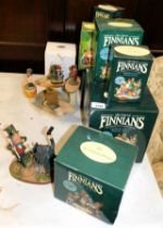 Decorative Declan Finnians models with boxes, with a wooden display stand.