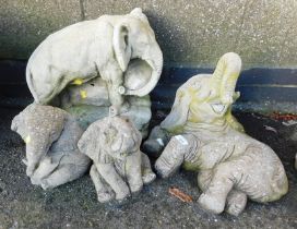 Garden ornaments in the form of elephants, two seated, one recumbent and one standing. (4)