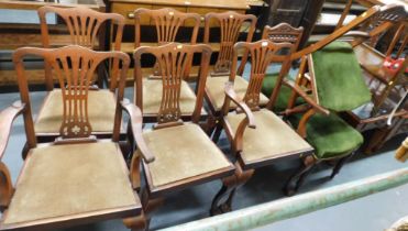 A set of six George III style mahogany dining chairs, each with ball and claw feet, and drop in seat