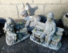 Three garden ornaments, of a deer, gentleman and lady, each seated on a bench.