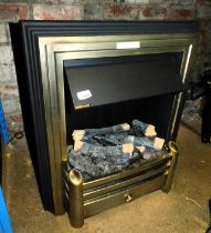 A Dimplex Opti-Myst electric fire, with wood effect to base, with remote control and spare bulb.