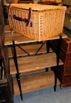 A wicker basket and free standing shelves.