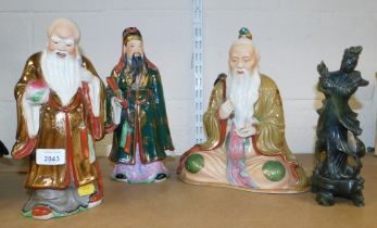 Oriental ceramics and wares, including a green stone sculpture of Guanyin and three Immortals.