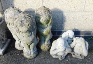 Garden ornaments in the form of three standing lions, and three monkeys, hear no, see no and speak n