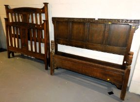 A 17thC style oak head and tail board and a further Victorian Art Nouveau style head and tail board.