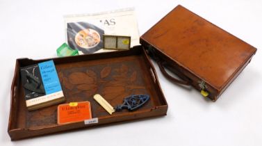 A small leather suitcase, glassware and metalware. (1 tray)