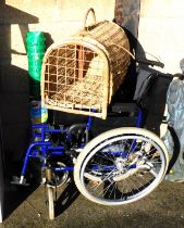 A large wicker cat basket, premium barrier fencing and a folding wheelchair.