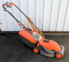 A Flymo Visimo electric lawnmower.
