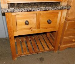 A butcher's block with marble top, above two drawers, above shelf below.