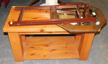 A hexagonal bevelled mirror in oak frame, a stand for furniture, and a pine two tier coffee table.