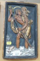A plaque depicting St Christopher carrying a child across water.