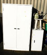 A metal two door cabinet, a small single door metal cabinet with shelf to interior, a metal stool, m