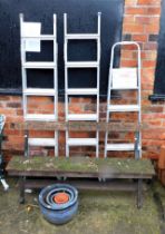 A wooden and metal garden bench, three aluminium step ladders and four planters. (8)