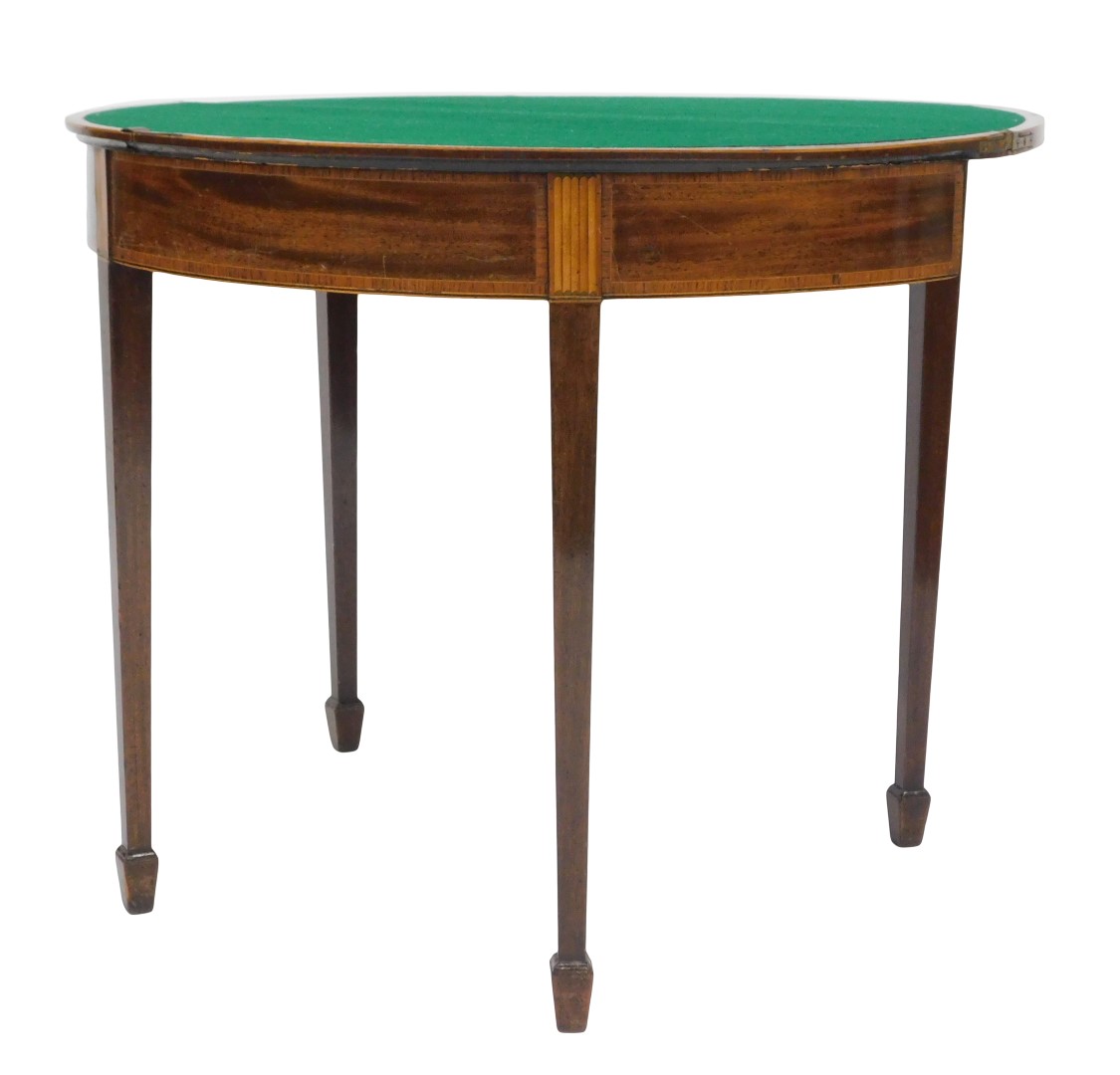 A George III mahogany demi lune fold over card table, with rosewood cross banding and satinwood sunb