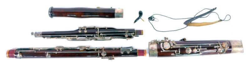 A Renierd wooden cased Basson, with plated mounts and fittings, four section, no. 18761.