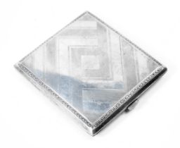 A white metal cigarette case, with a scroll border and engine engraved boxed design, with a silver g