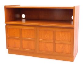 A Nathan teak side cabinet, the rectangular top with a recess above two panelled doors, on plinth ba