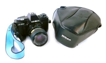 A Minolta X300 camera, with Carl Zeiss Jena 35-70mm Jenazoom 2 lens.