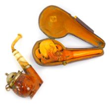 A late 19thC meerschaum pipe, with amber cheroot, modelled as a claw holding central bowl, in leathe