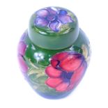 A Moorcroft pottery Anemone pattern ginger jar and cover, green ground, impressed marks, 11cm high.