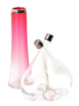 A cut glass conjoined oil and vinegar bottle, with silver mounts, 16cm high, and a cranberry glass v