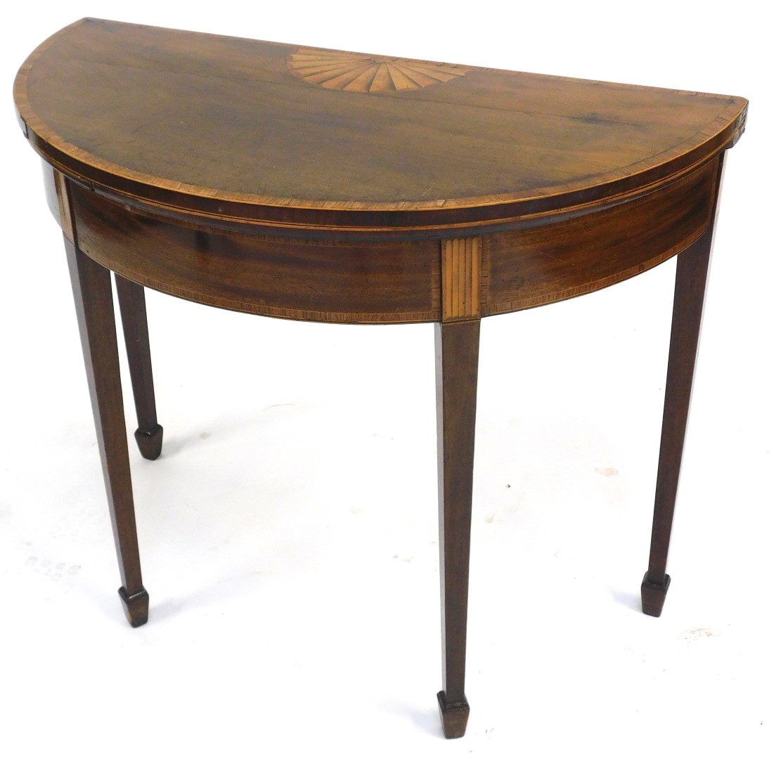 A George III mahogany demi lune fold over card table, with rosewood cross banding and satinwood sunb - Image 2 of 3