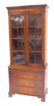 A 20thC mahogany display cabinet in Regency style, the top with dentil moulding above two glazed arc
