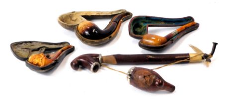 A group of pipes and pipe parts, comprising a Louvenir wooden pipe, in fitted case with amber mouthp