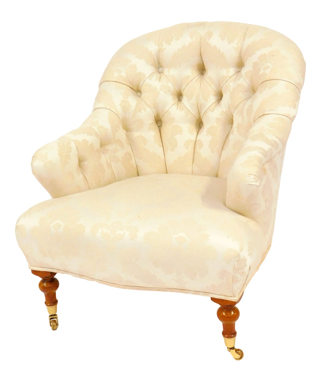 A 20thC armchair, upholstered in cream foliate pattern fabric, with a curved button back, shaped fro
